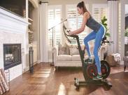 woman using indoor cycling bike_front
