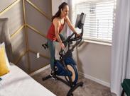 woman using spin bike_front